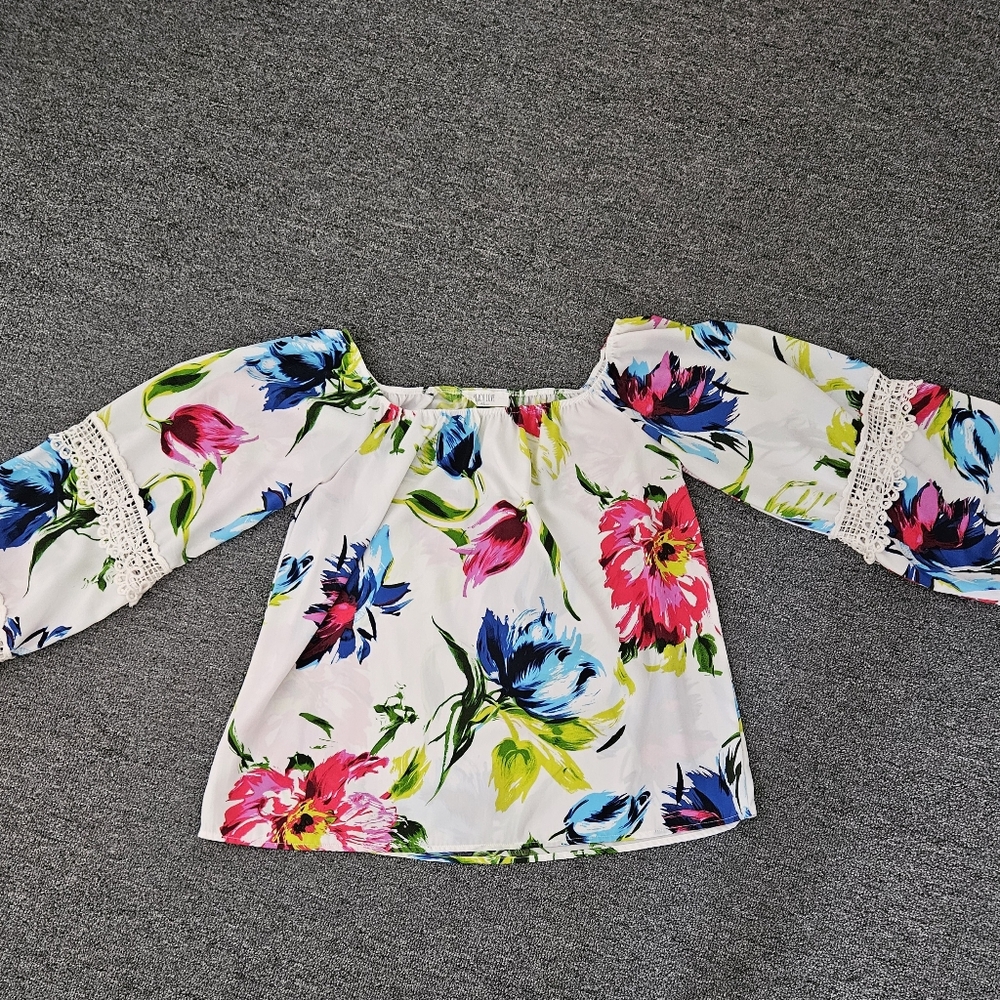 Off the shoulder, bright floral top.  Flat friendly!